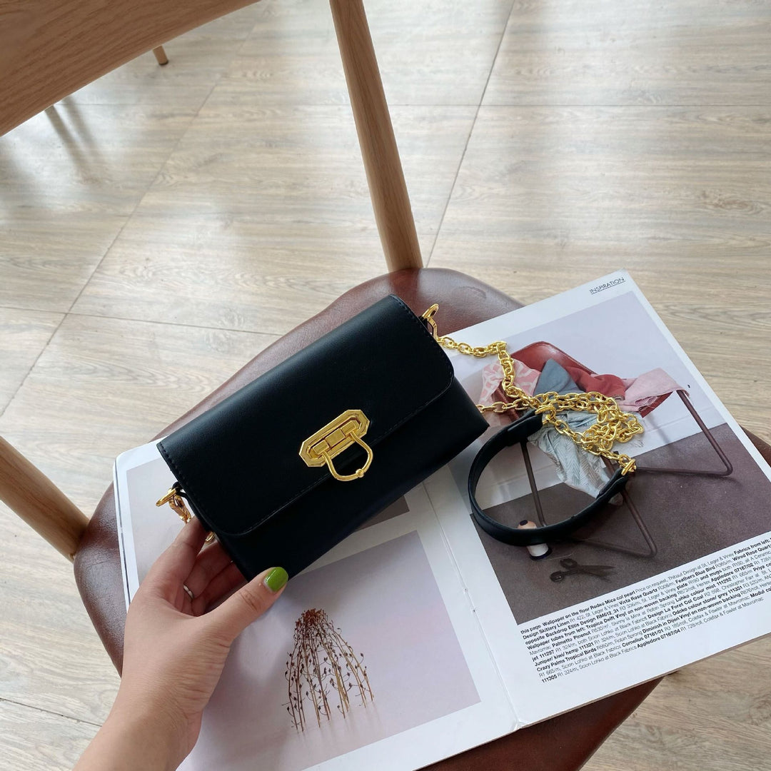 Damen Umhängetasche mit elegantem Kettenriemen und klappbarem Verschluss Nord Taschen