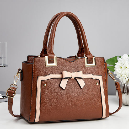 Damen elegante Handtasche mit schimmerndem Schleifendetail und abnehmbarem Schulterriemen Nord Taschen