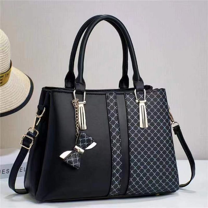 Damen Handtasche mit edlem Strukturdesign und dekorativem Schleifen-Anhänger Nord Taschen
