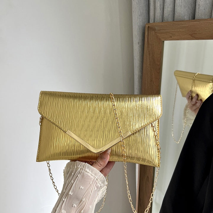 Damen elegante Clutch mit strukturiertem Obermaterial und goldenen Akzenten Nord Taschen
