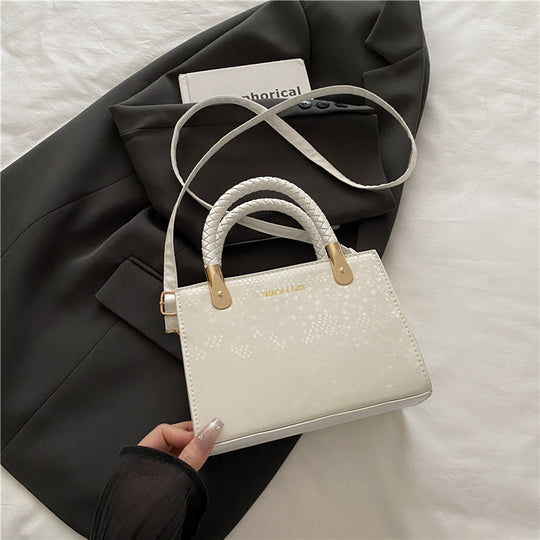 Damen Designer Handtasche mit strukturiertem Obermaterial und goldenen Akzenten Nord Taschen