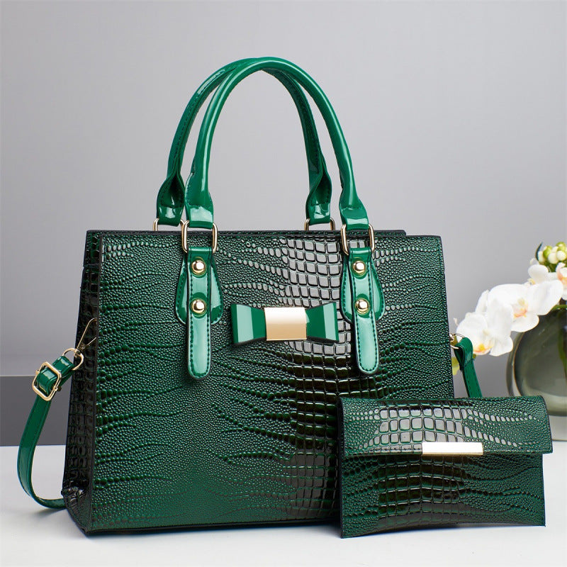 Damen elegante Handtasche mit schicker Schleifenapplikation und edlem Krokodil-Look Nord Taschen