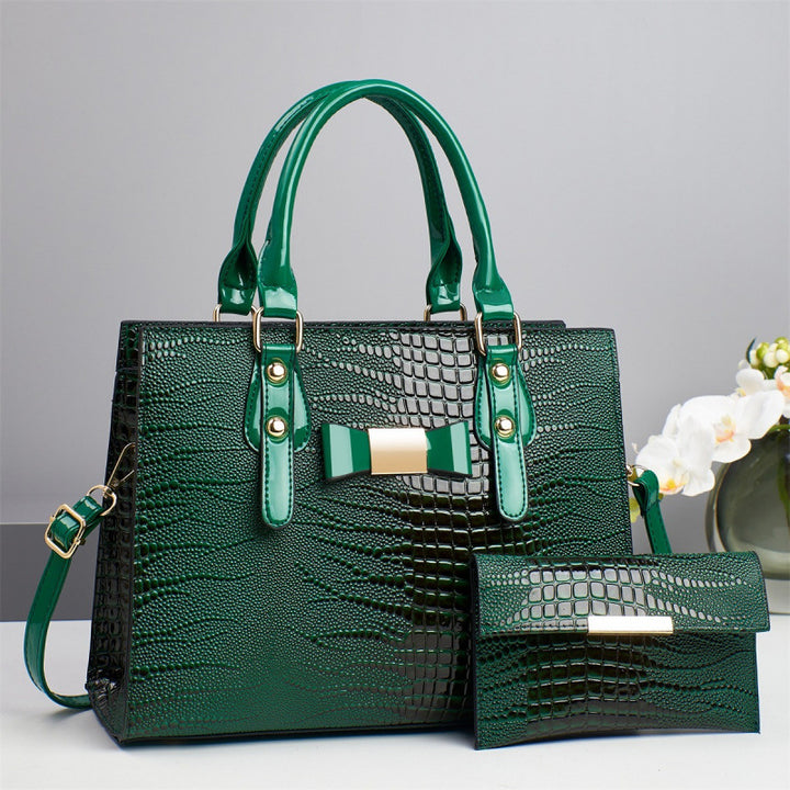 Damen elegante Handtasche mit schicker Schleifenapplikation und edlem Krokodil-Look Nord Taschen