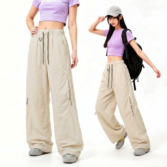 Damen Oversize Tech-Loungehose mit Kontrastnähten, reflektierenden Reißverschlusstaschen & Kordelbund Nord Taschen