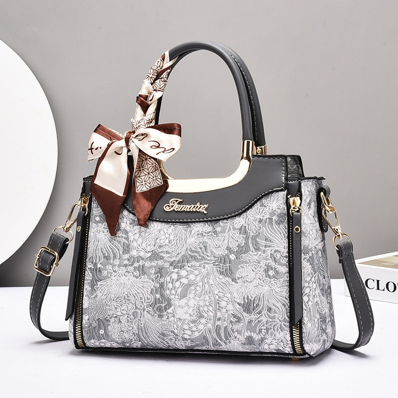 Damen elegante Handtasche mit floralem Design und Schmuckdetails Nord Taschen