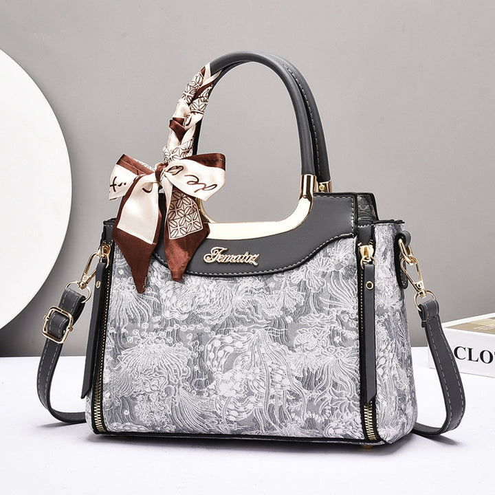 Damen elegante Handtasche mit floralem Design und Schmuckdetails Nord Taschen