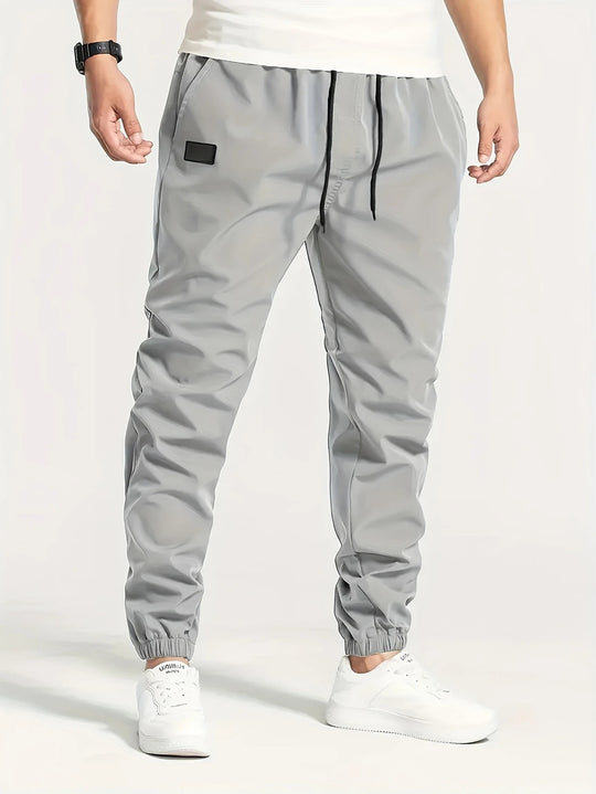 Herren Technische Jogginghose im Tapered‑Utility‑Stil mit elastischem Bund & Knöchelbündchen Nord Taschen