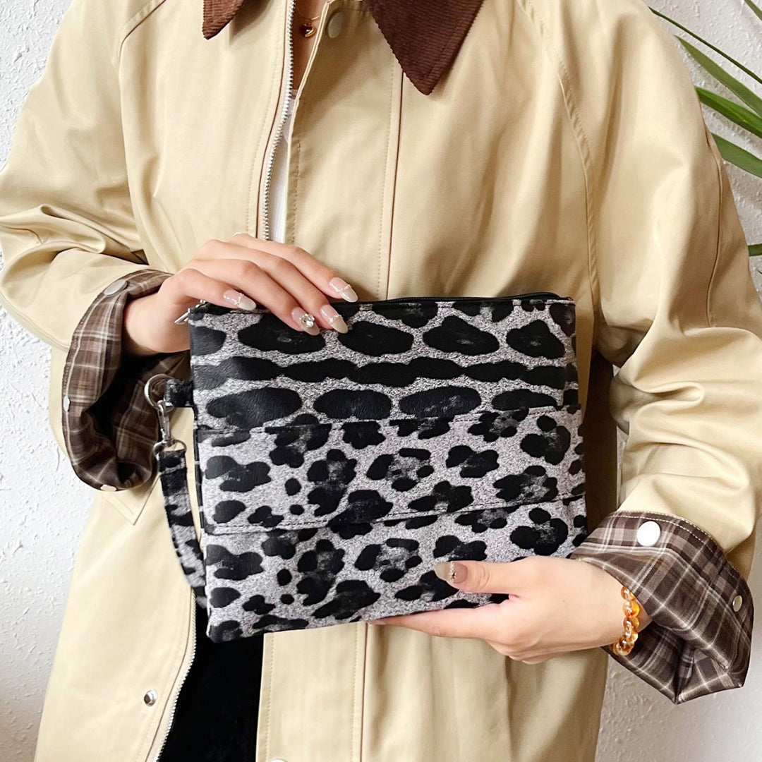Damen Clutch mit tierischem Leoprint Nord Taschen