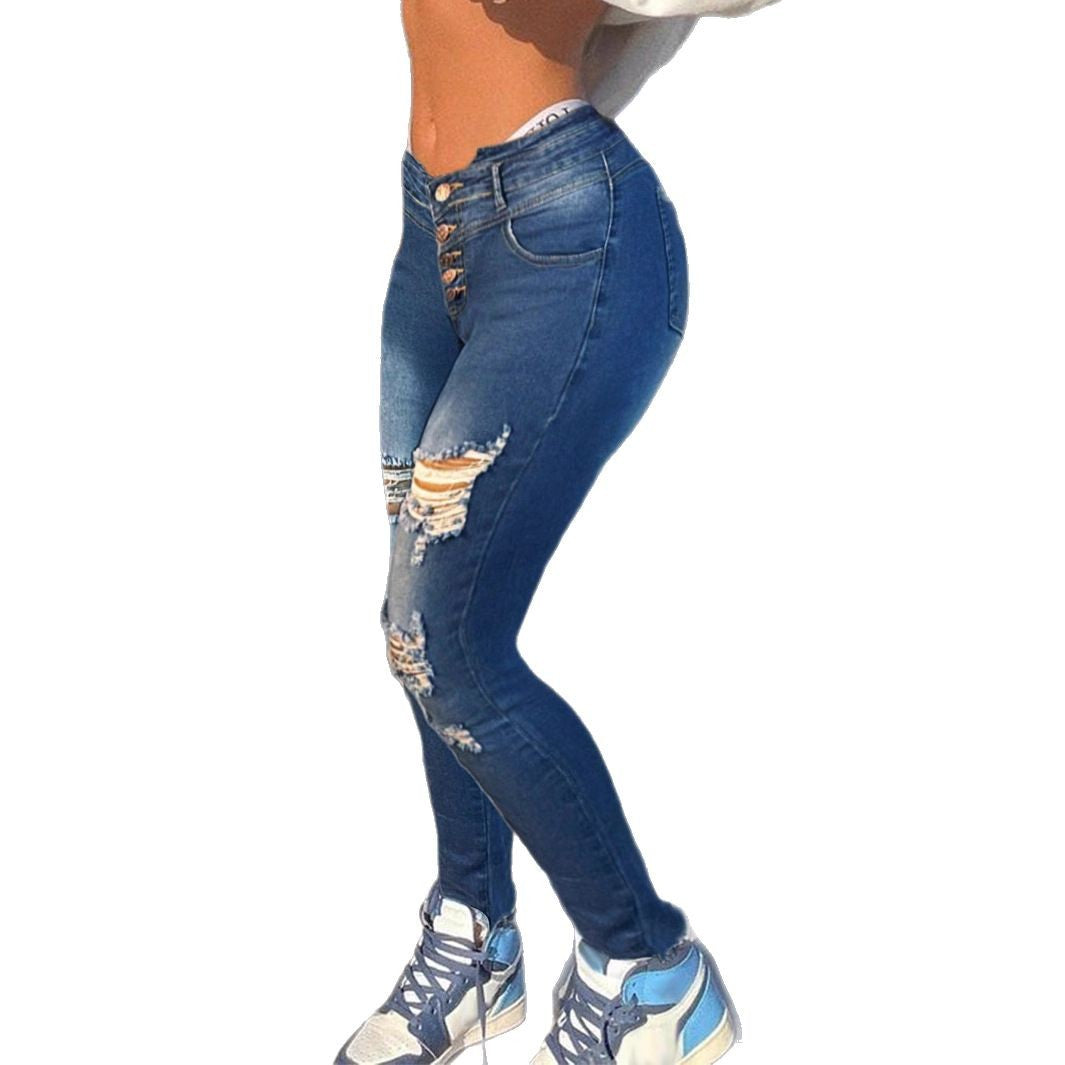 Damen formende High-Waist Skinny-Jeans mit asymmetrischen Rissen und Fransenpatch Nord Taschen