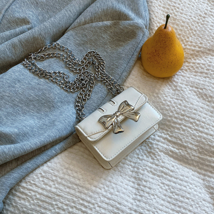 Damen Mini-Handtasche mit schimmerndem Schleifenverschluss Nord Taschen