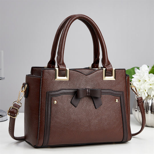 Damen elegante Handtasche mit schimmerndem Schleifendetail und abnehmbarem Schulterriemen Nord Taschen