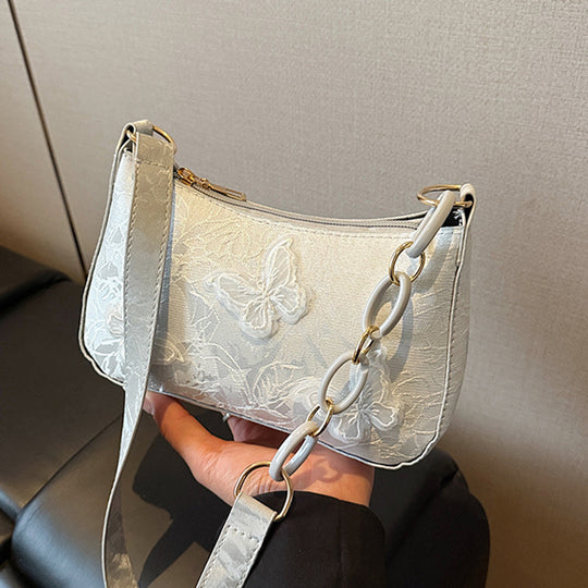 Damen Handtasche mit handgearbeitetem Blumenmuster und modischem Kettenriemen Nord Taschen
