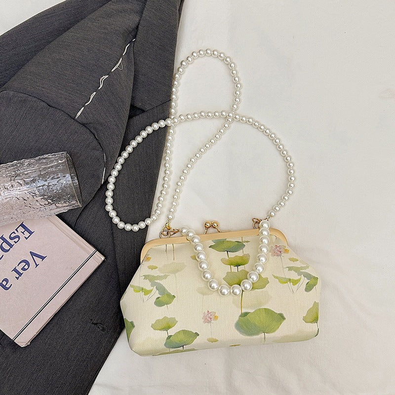 Damen elegante Handtasche mit zartem Blumendruck und Perlenkette Nord Taschen