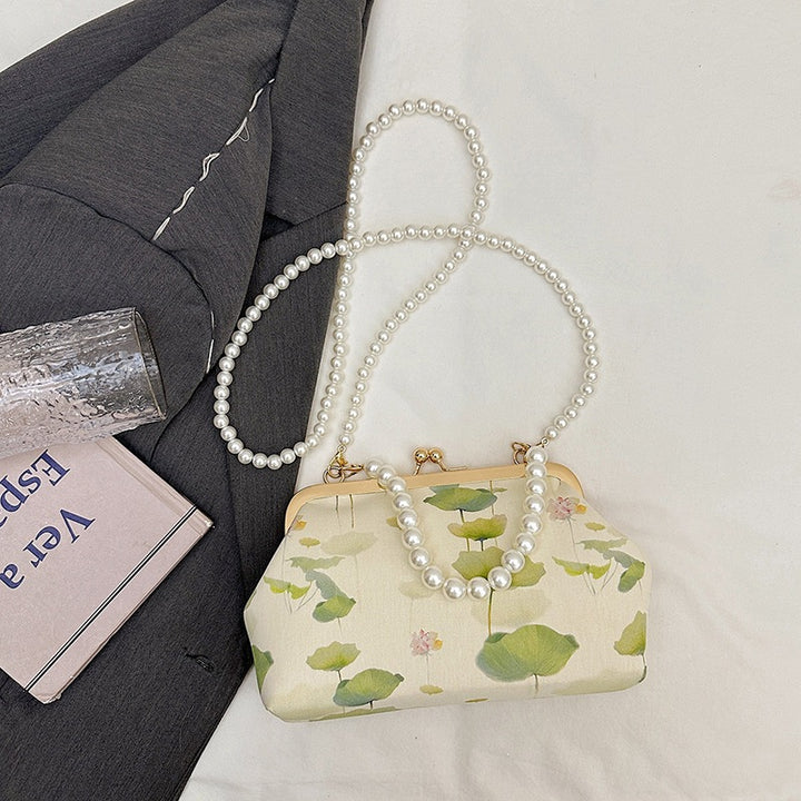 Damen elegante Handtasche mit zartem Blumendruck und Perlenkette Nord Taschen