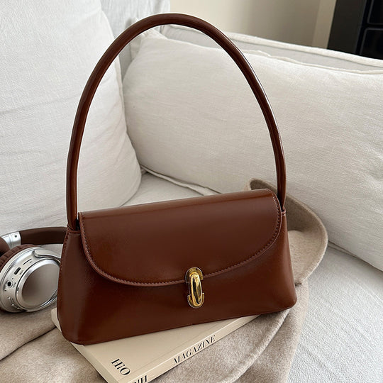 Damen elegante Handtasche mit geschwungenem Design und hochwertigem Kettenverschluss Nord Taschen