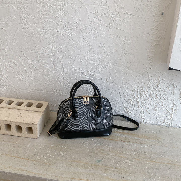 Damen elegante Handtasche im stilvollen Schlangenleder-Look Nord Taschen