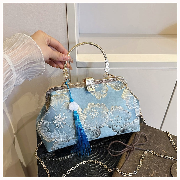 Damen elegante Clutch-Tasche mit floralem Druck und goldenen Akzenten Nord Taschen