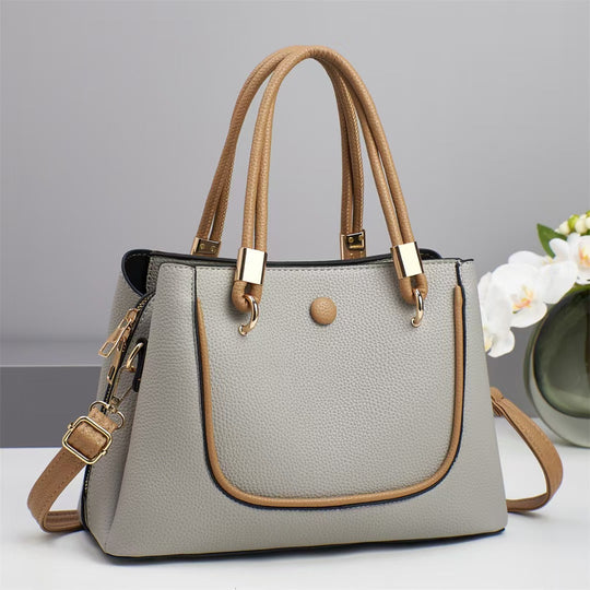 Damen Handtasche mit goldenen Akzenten und eleganter Struktur Nord Taschen