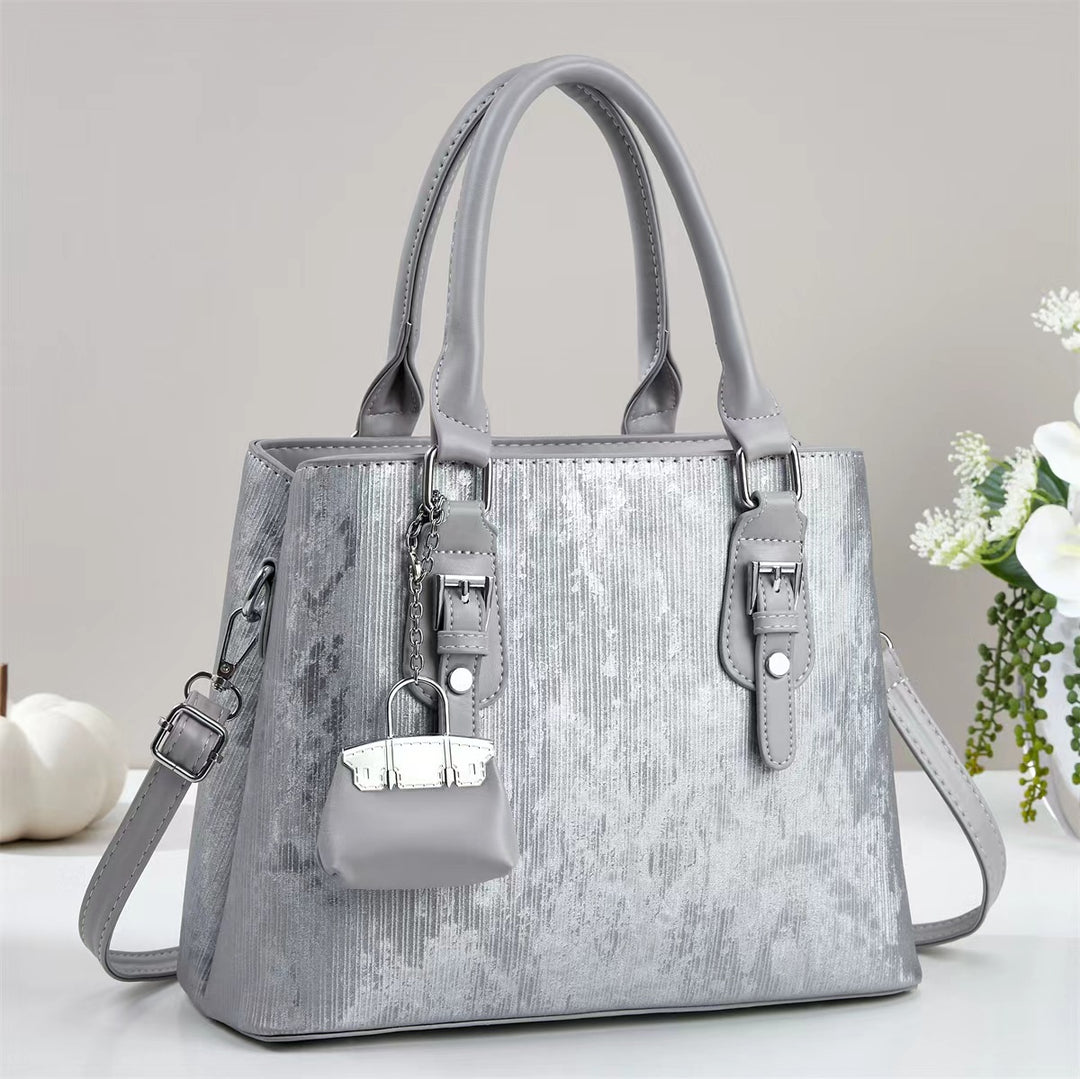 Damen elegante Handtasche mit dekorativem Schlüsselanhänger Nord Taschen