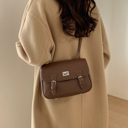 Damen elegante Umhängetasche aus strukturiertem Kunstleder mit praktischen Schnallen Nord Taschen