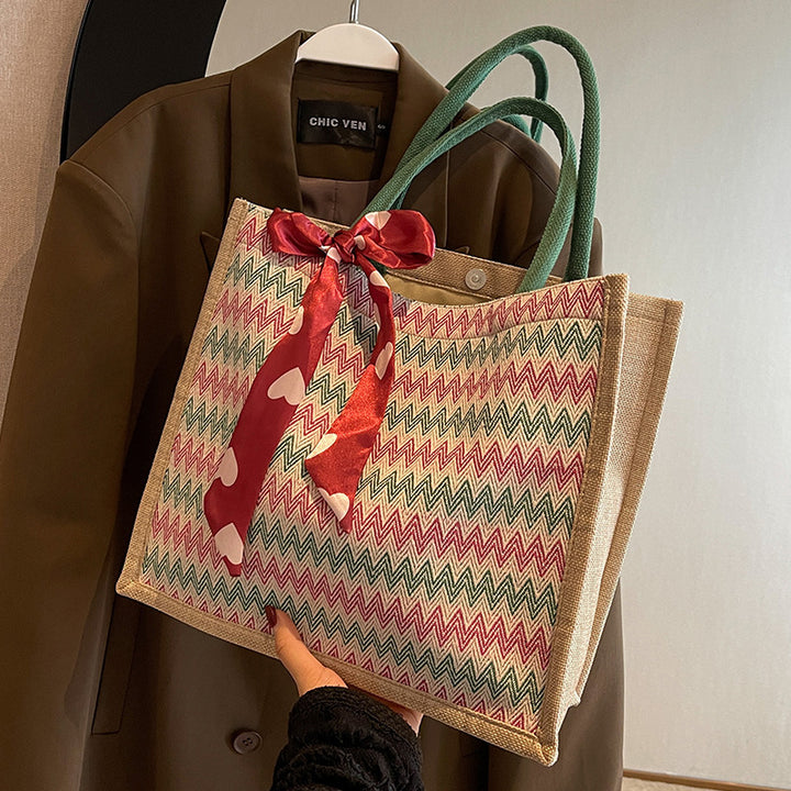 Damen Jute-Shopper mit modernem Wellenmuster und dekorativem Schleifenakzent Nord Taschen