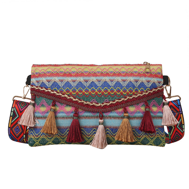 Damen modische Clutch-Tasche mit fransigen Akzenten und buntem Stickmuster Nord Taschen