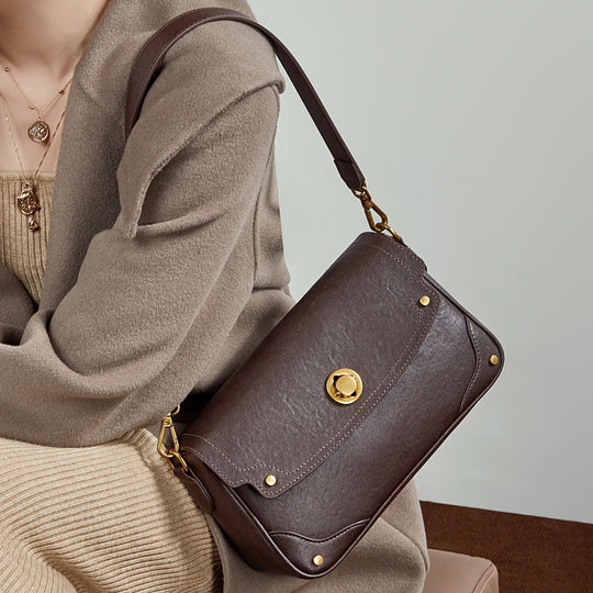 Damen Umhängetasche aus hochwertigem Kunstleder mit eleganter Klappenöffnung Nord Taschen