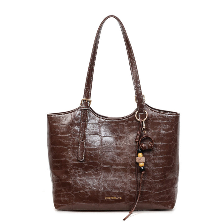 Damen elegante Handtasche im Krokoleder-Look mit charmantem Anhänger Nord Taschen