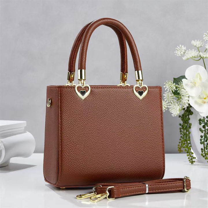 Damen stylische Handtasche mit schimmernden Herzanhängern Nord Taschen
