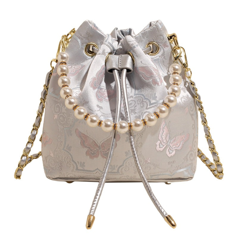 Damen Umhängetasche mit luxuriösem Perlenbesatz und floralen Details Nord Taschen