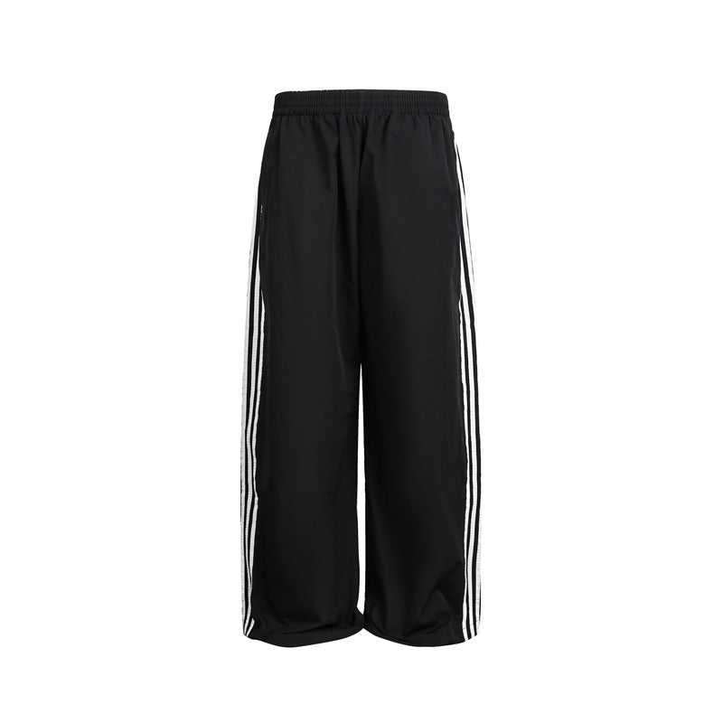 Damen weite Satin-Trainingshose mit elastischem Bund und seitlichen Kontraststreifen Nord Taschen