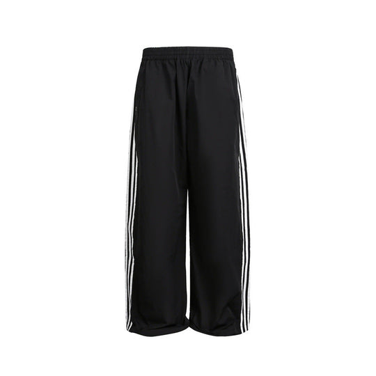 Damen weite Satin-Trainingshose mit elastischem Bund und seitlichen Kontraststreifen Nord Taschen