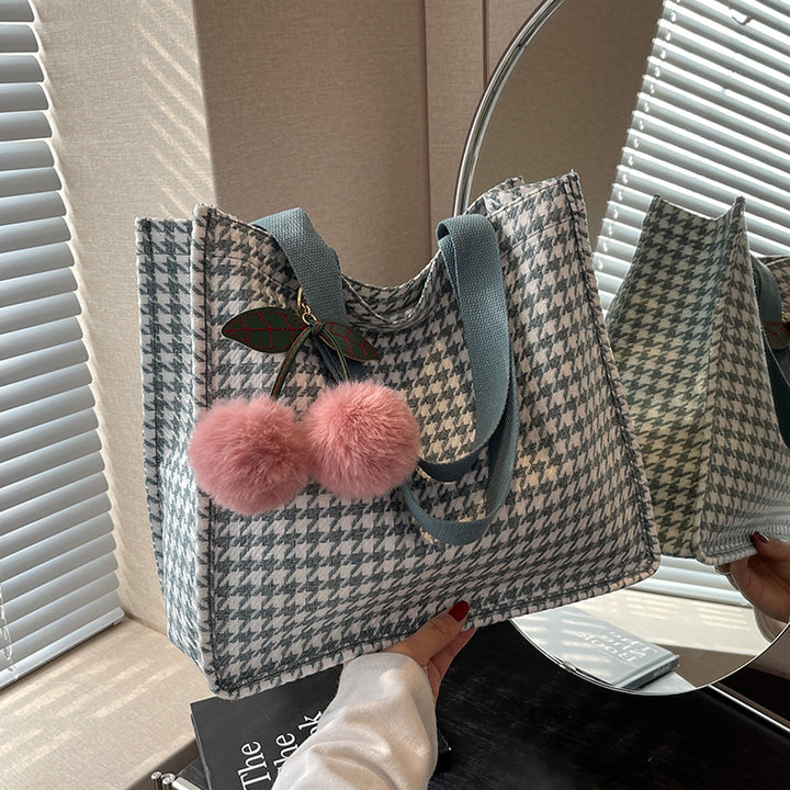 Damen vielseitige Einkaufstasche mit modernem Karomuster und verspielten Quasten Nord Taschen