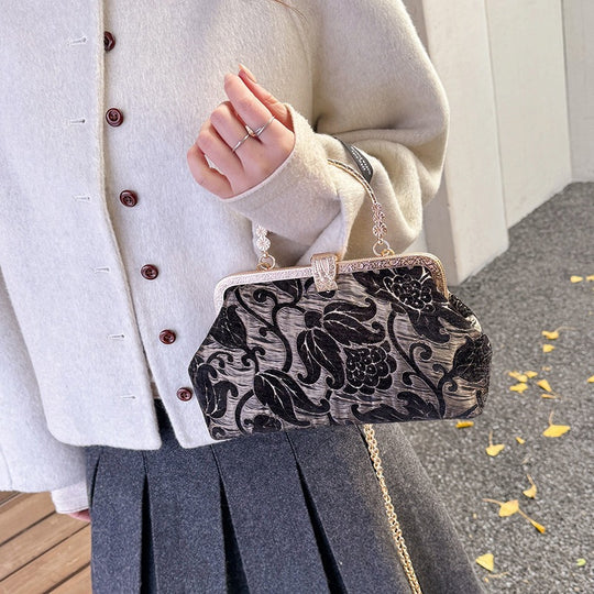 Damen stilvolle Handtasche mit floralem Design und goldfarbenen Akzenten Nord Taschen