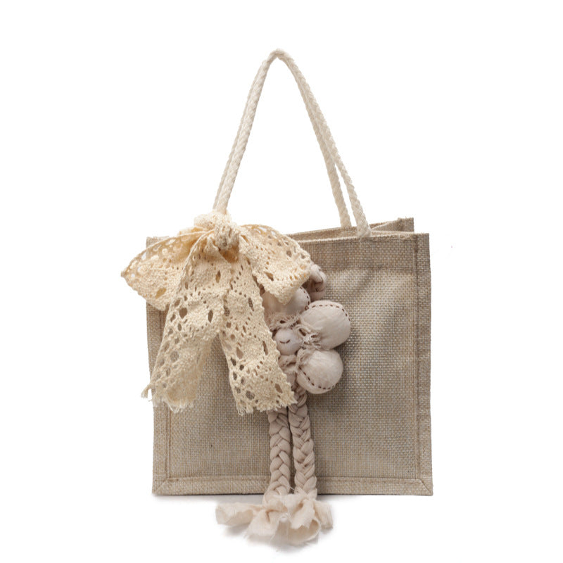 Damen Handtasche mit floralen Details und romantischem Bogen Nord Taschen
