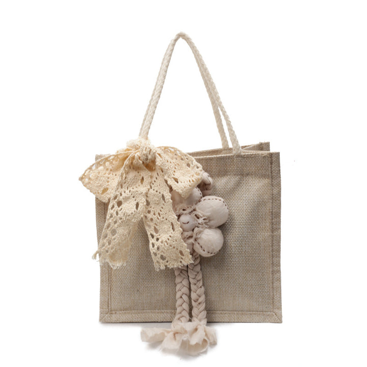 Damen Handtasche mit floralen Details und romantischem Bogen Nord Taschen