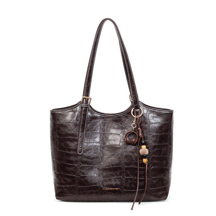 Damen elegante Handtasche im Krokoleder-Look mit charmantem Anhänger Nord Taschen