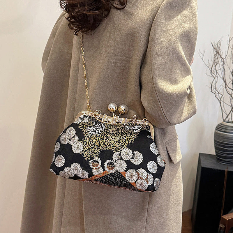 Damen elegante Umhängetasche mit floralem Design und Kunstlederakzenten Nord Taschen
