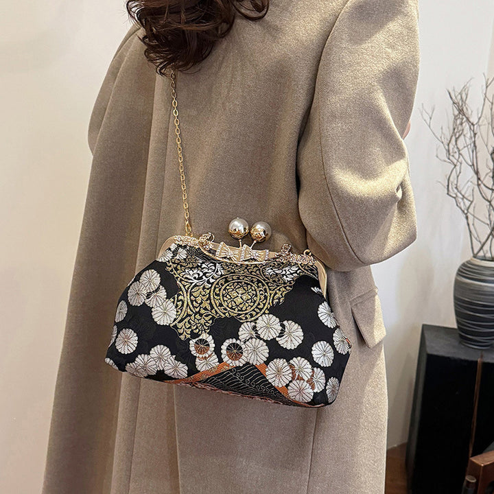 Damen elegante Umhängetasche mit floralem Design und Kunstlederakzenten Nord Taschen