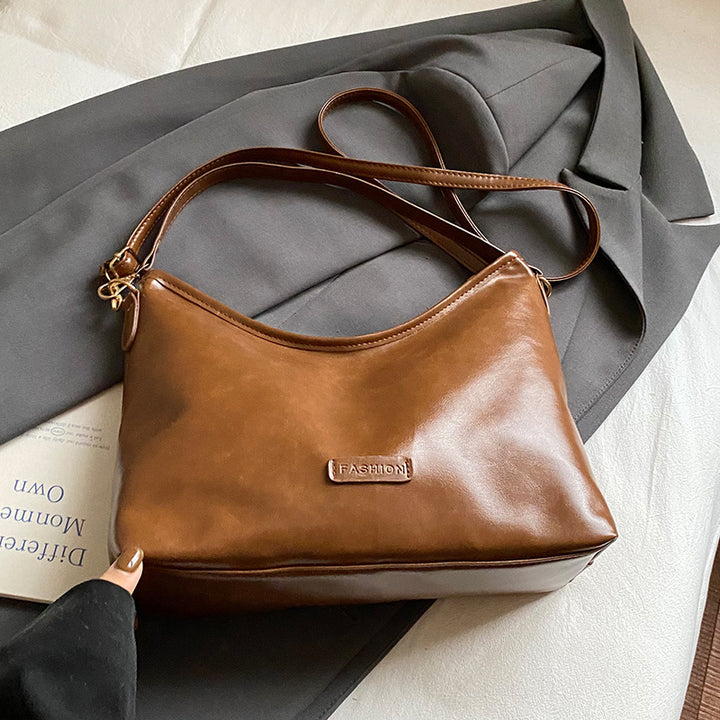 Damen Hobo-Tasche mit elegantem Design und dekorativem Quastenanhänger Nord Taschen