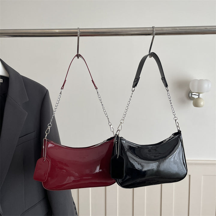 Damen elegante Umhängetasche mit glänzender Lackoberfläche Nord Taschen