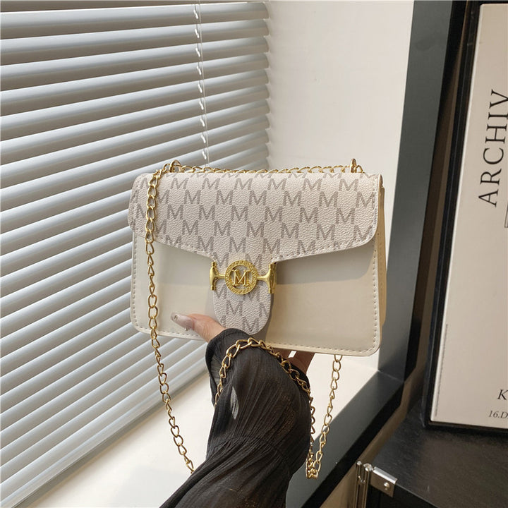 Damen Umhängetasche mit goldener Kettenverzierung und Designer-Logo Nord Taschen