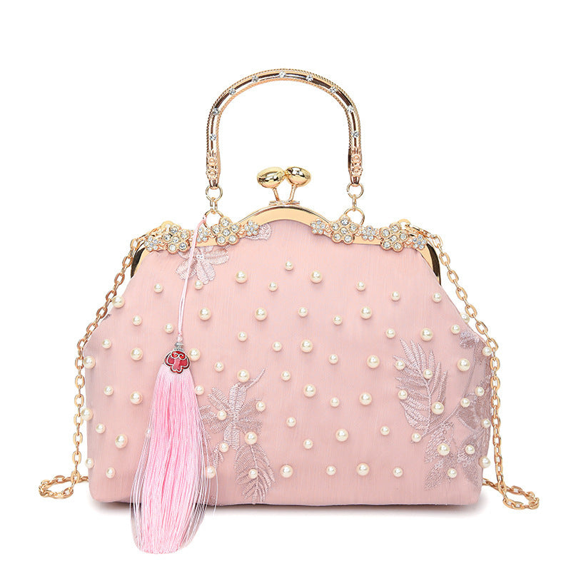 Damen elegante Handtasche mit perlenverziertem Design und Metallakzenten Nord Taschen