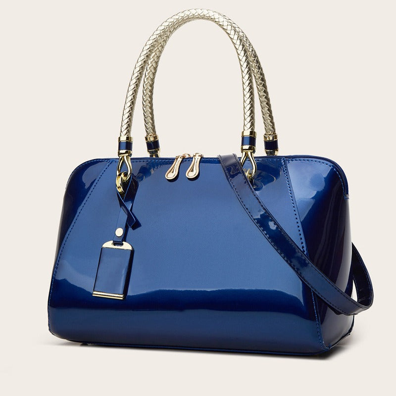 Damen Handtasche mit eleganter Lackoberfläche und geflochtenen Griffen Nord Taschen