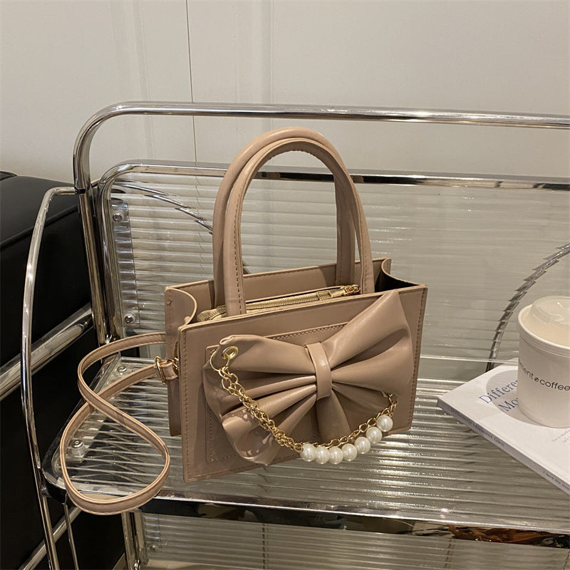 Damen elegante Handtasche mit Schleifenakzent und Perlenverzierung Nord Taschen
