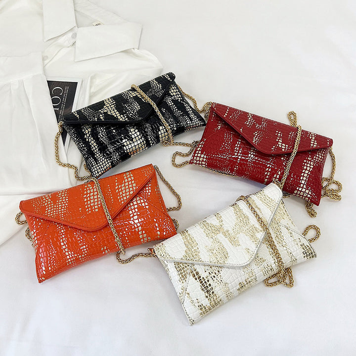Damen Glamouröse Clutch-Tasche mit Kroko-Prägung und goldenen Akzenten Nord Taschen