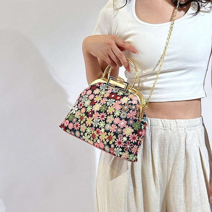 Damen elegante Umhängetasche mit floralen Akzenten und goldenen Verzierungen Nord Taschen
