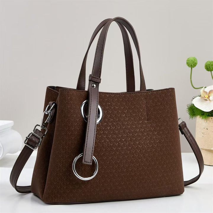 Damen Handtasche mit strukturiertem Design und eleganten Ringdetails Nord Taschen