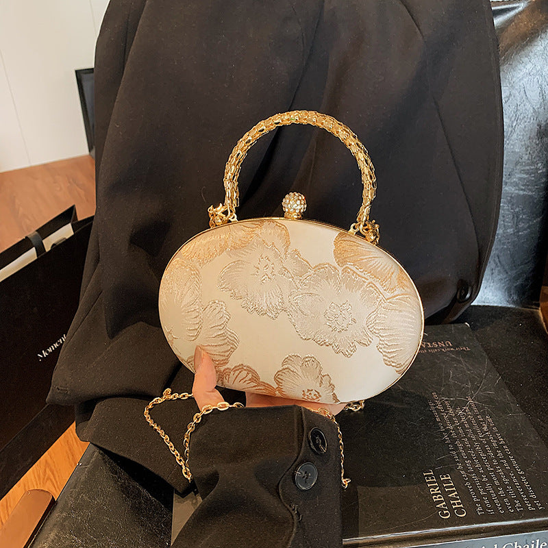 Damen Clutch mit floralem Muster und goldenen Akzenten Nord Taschen