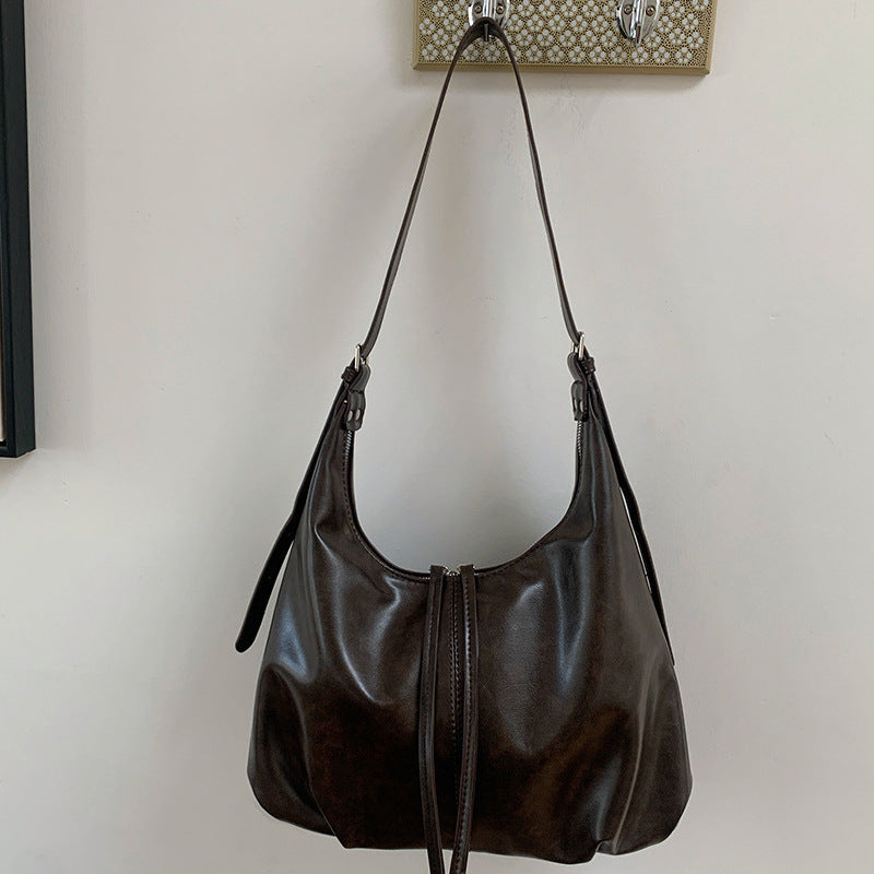 Damen Hobo-Tasche mit modernem, geschwungenem Design und praktischen Reißverschlussfächern Nord Taschen